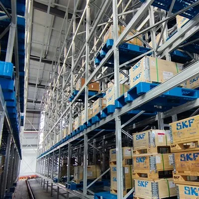 Can an ASRS stacker crane be used in a warehouse with a high - dust environment?